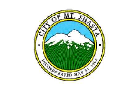 City of Mt. Shasta Seal depicting a stylized mountain in green with snow caps on top, clear blue sky behind. 